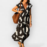 Loose-fitting dress with a V-neckline and modern design