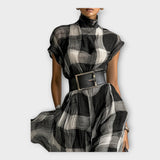 Suknelė, pasižyminti rafinuotu plazdenimu ir elegancija